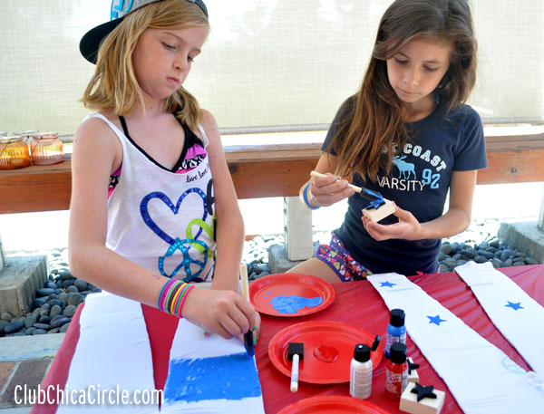 tweens crafting with homemade stamps and fabric paint