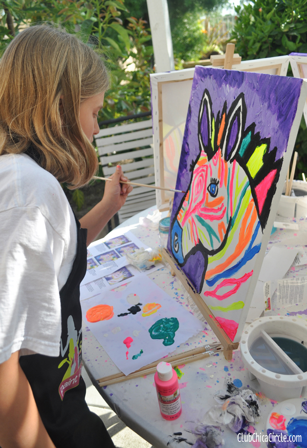 tween girl painting electric zebra at art party