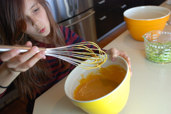 Mix the moist ingredients for best pumpkin zucchini muffins