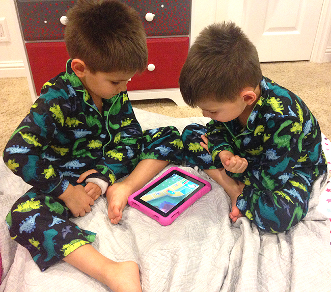 Twins loving the LIFE game on the Amazon Fire HD Kids Edition